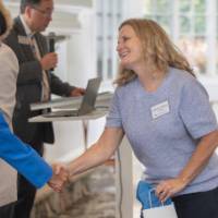 Adrian Copeland receiving her bag